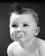 1940s-sad-baby-with-pouting-lower-lip-vintage-images.webp