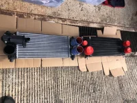 Mishimoto Intercooler and OEM intercooler.webp